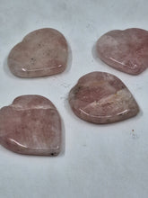 Load image into Gallery viewer, A set of 4 rose quartz heart worry stones on a serene white background.
