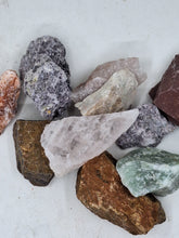 Load image into Gallery viewer, A collection of Brazilian mixed gemstone chips raw 250g healing stones on a serene white background.
