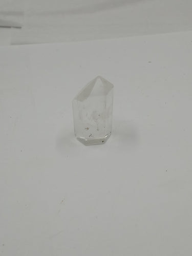 A stunning natural himalayan quartz points stone on a serene white background.