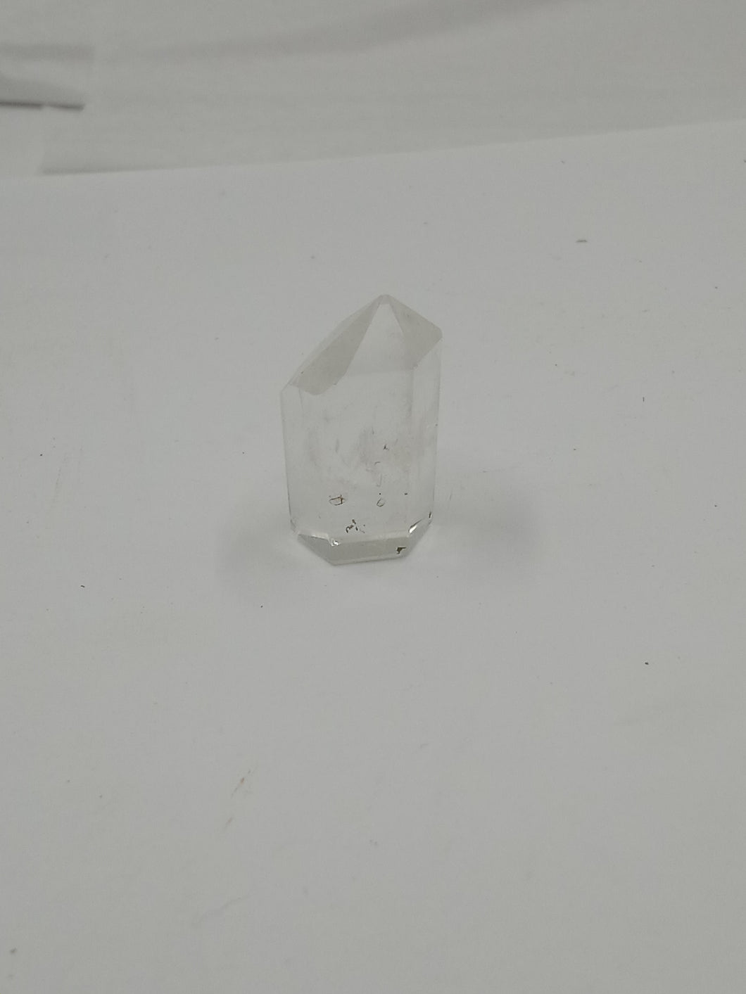A stunning natural himalayan quartz points stone on a serene white background.
