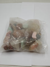 Load image into Gallery viewer, A collection of Brazilian mixed gemstone chips raw 250g bag on a serene white background.
