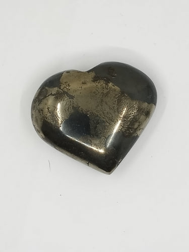 A pyrite puffy heart stone featuring a black and gray design on a white background.