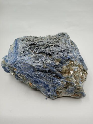 An amazing shape natural blue Kyanite Chunk crystal on serene white surface.